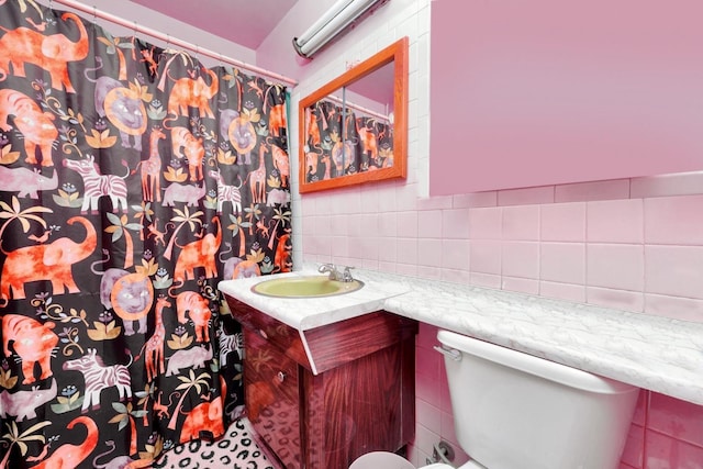 bathroom featuring vanity, tile walls, a shower with curtain, and toilet