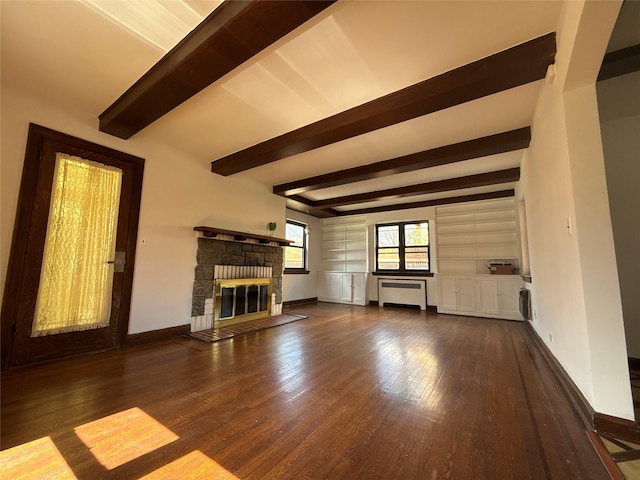unfurnished living room with a stone fireplace, baseboards, beamed ceiling, hardwood / wood-style floors, and radiator