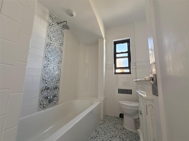full bathroom with toilet, tile walls, shower / tub combination, radiator heating unit, and tile patterned floors