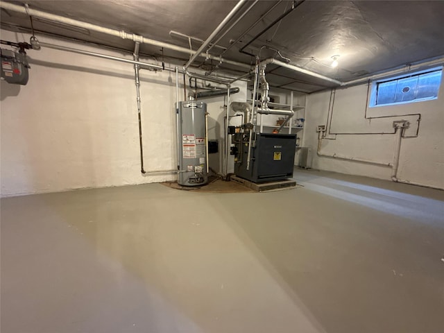 basement with gas water heater and a heating unit