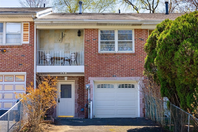 168 Vails Gate Heights Dr, New Windsor, NY 12553 - view of front of home featuring brick siding, a balcony, a garage, and fence