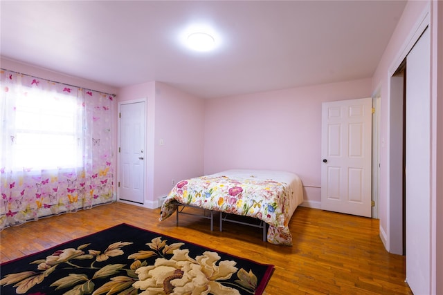 168 Vails Gate Heights Dr, New Windsor, NY 12553 - bedroom with baseboards and wood finished floors