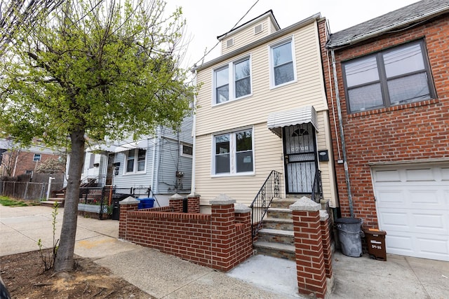 5933 48th Ave, Woodside, NY 11377 - view of front facade featuring a garage and fence