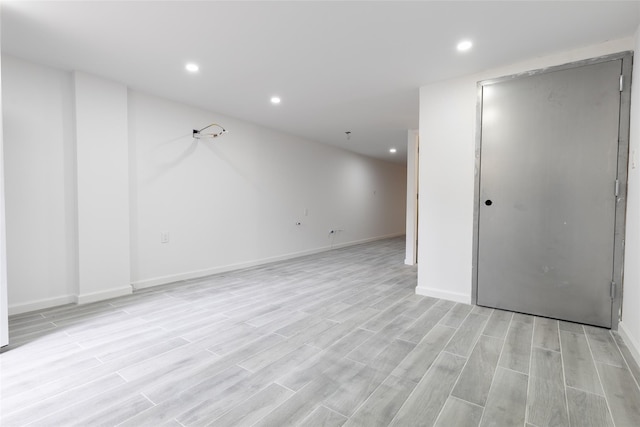 5933 48th Ave, Woodside, NY 11377 - basement with recessed lighting, light wood finished floors, and baseboards