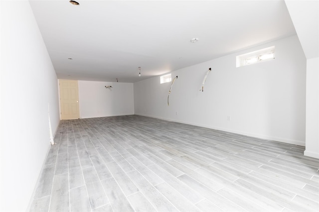 5933 48th Ave, Woodside, NY 11377 - below grade area featuring light wood finished floors and baseboards