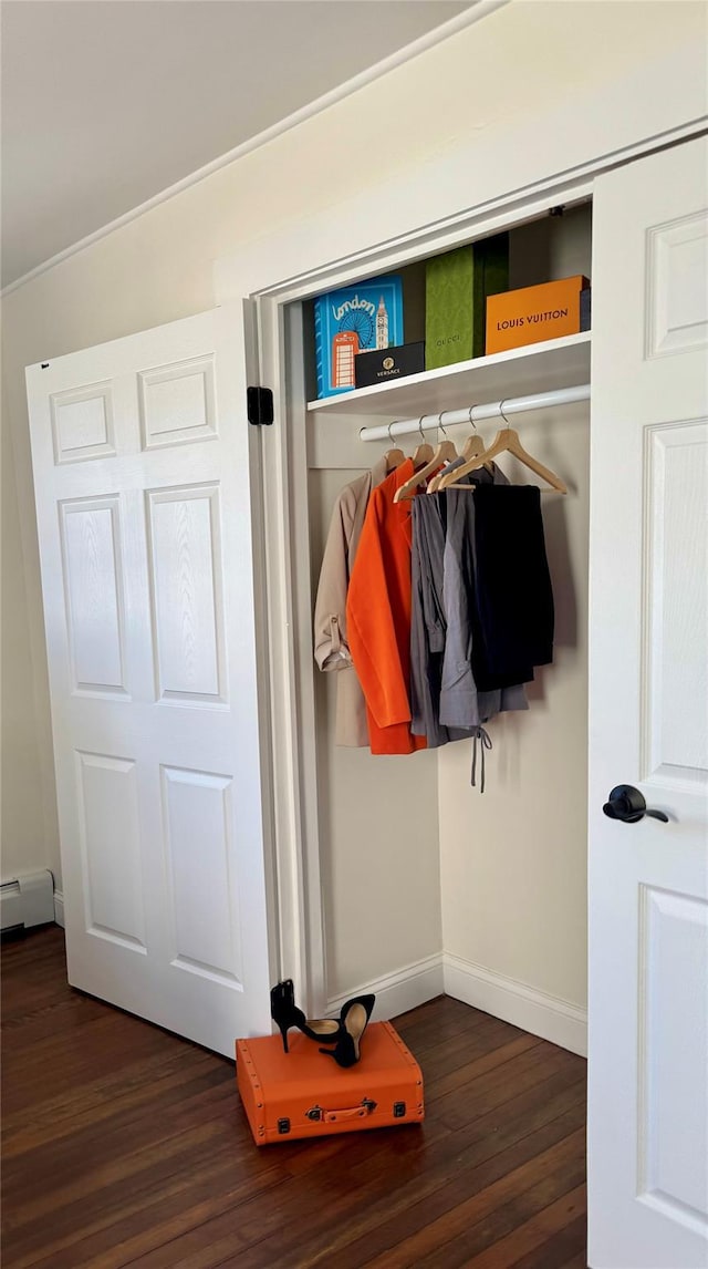 closet with a baseboard heating unit