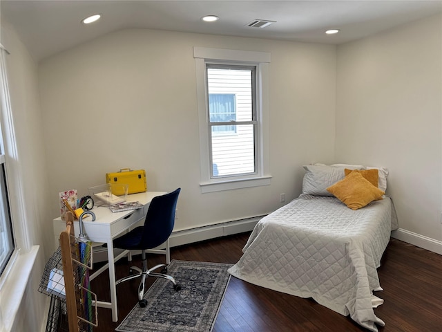 bedroom with vaulted ceiling, visible vents, wood finished floors, a baseboard heating unit, and baseboards