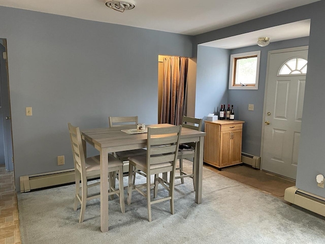 dining room with baseboard heating and a baseboard radiator