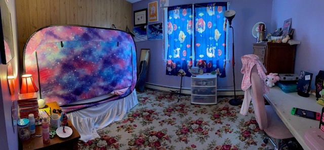 interior space with carpet and a baseboard heating unit