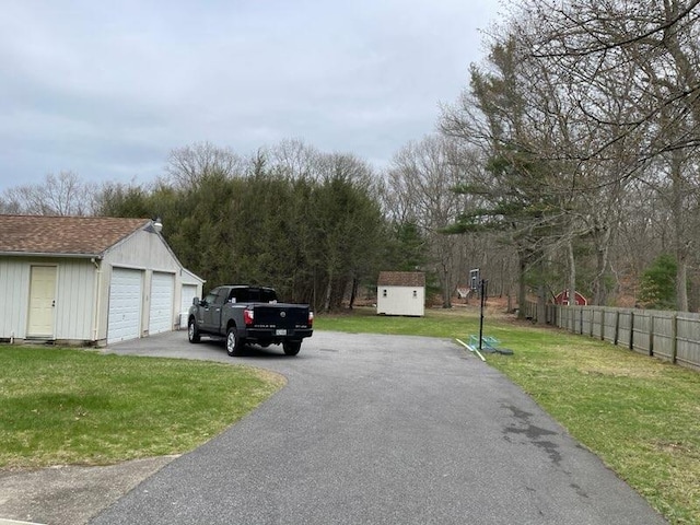 view of road featuring aphalt driveway