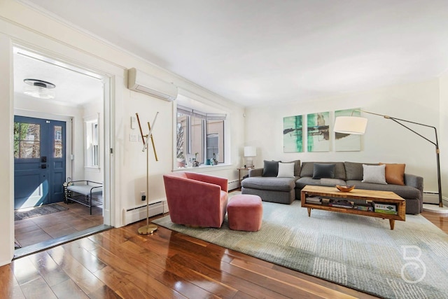 living area with a baseboard heating unit, hardwood / wood-style flooring, a wall mounted AC, and ornamental molding