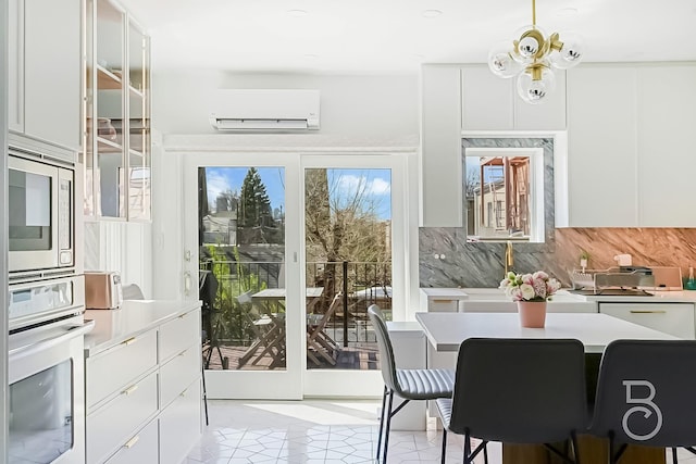 interior space featuring a wall unit AC and light tile patterned floors