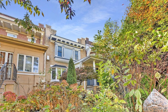 view of front of house featuring brick siding