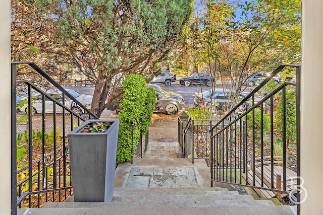 view of gate with stairway