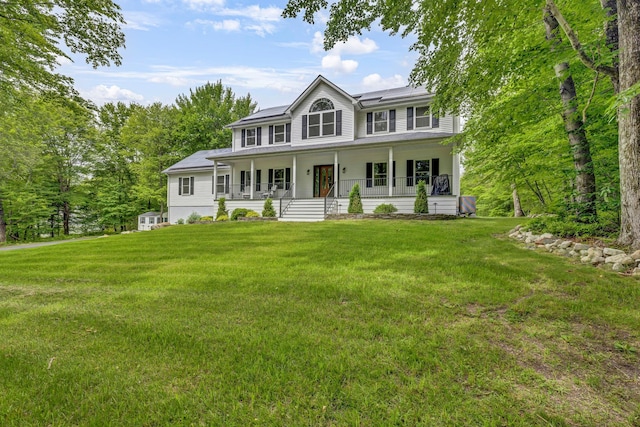 309 Quannacut Rd, Pine Bush, NY 12566 - colonial inspired home with a porch, roof mounted solar panels, and a front lawn