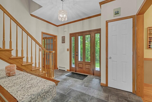 309 Quannacut Rd, Pine Bush, NY 12566 - entryway with a baseboard heating unit, a chandelier, crown molding, stone finish flooring, and stairs
