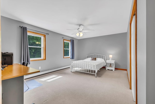 309 Quannacut Rd, Pine Bush, NY 12566 - bedroom with baseboard heating, carpet floors, a desk, baseboards, and a ceiling fan