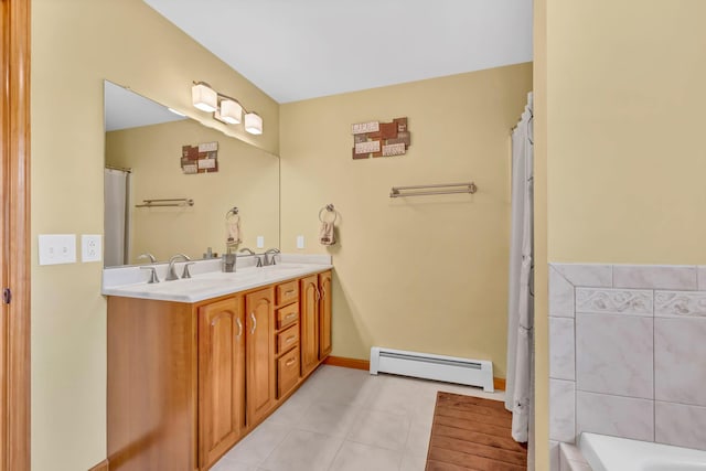 309 Quannacut Rd, Pine Bush, NY 12566 - full bath featuring a baseboard heating unit, double vanity, and a bath
