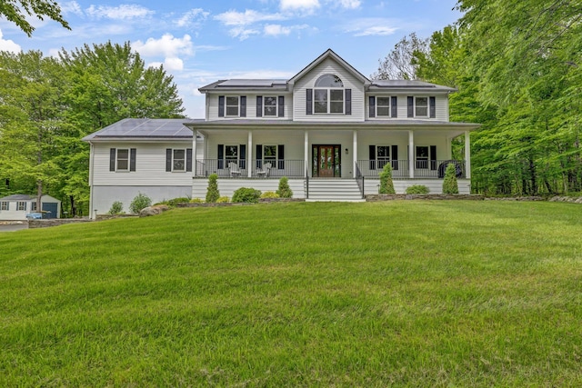 309 Quannacut Rd, Pine Bush, NY 12566 - view of front of house featuring covered porch, solar panels, and a front lawn