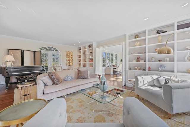 living room with crown molding, recessed lighting, built in features, and wood finished floors
