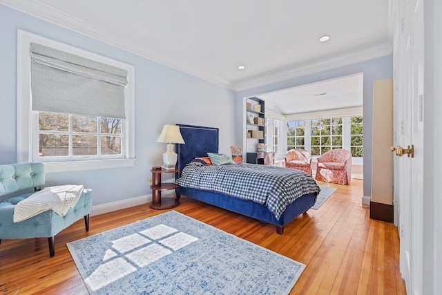 bedroom with crown molding, recessed lighting, baseboards, and hardwood / wood-style floors