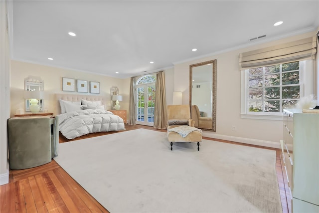 bedroom with visible vents, ornamental molding, recessed lighting, and hardwood / wood-style flooring