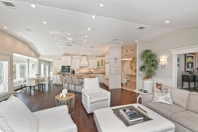living area featuring a ceiling fan, lofted ceiling, dark wood-style flooring, and recessed lighting