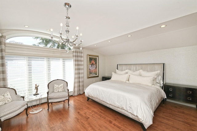 bedroom with lofted ceiling, wood finished floors, an inviting chandelier, and recessed lighting