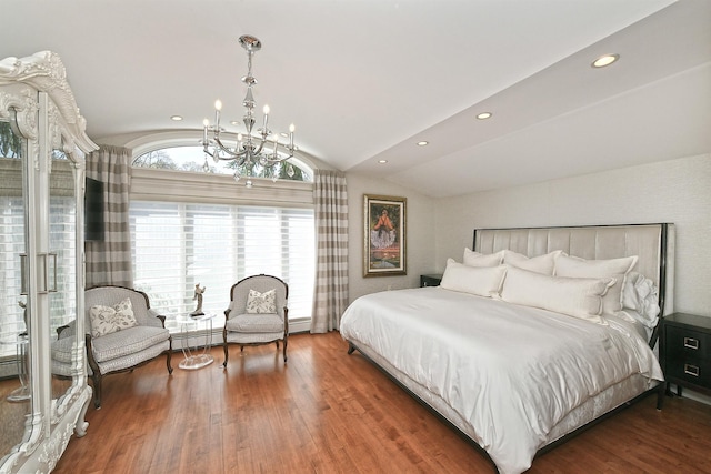 bedroom with recessed lighting, vaulted ceiling, wood finished floors, baseboard heating, and a notable chandelier