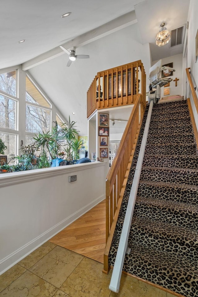 225 Toleman Rd, Washingtonville, NY 10992 - stairway with visible vents, stone tile floors, baseboards, vaulted ceiling with beams, and ceiling fan with notable chandelier