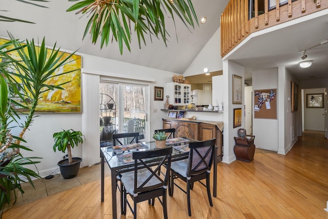 225 Toleman Rd, Washingtonville, NY 10992 - dining room featuring light wood-type flooring, baseboards, visible vents, and high vaulted ceiling