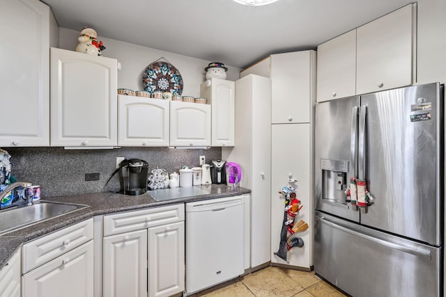 225 Toleman Rd, Washingtonville, NY 10992 - kitchen featuring dark countertops, white dishwasher, white cabinetry, stainless steel fridge with ice dispenser, and a sink