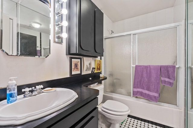 225 Toleman Rd, Washingtonville, NY 10992 - full bathroom with vanity, enclosed tub / shower combo, toilet, and tile patterned flooring