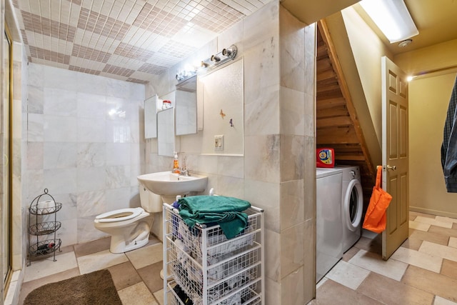 225 Toleman Rd, Washingtonville, NY 10992 - full bath featuring washer and dryer, toilet, tile walls, and a shower