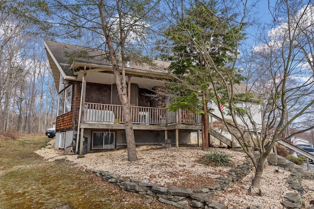 225 Toleman Rd, Washingtonville, NY 10992 - back of house featuring a shingled roof and stairway