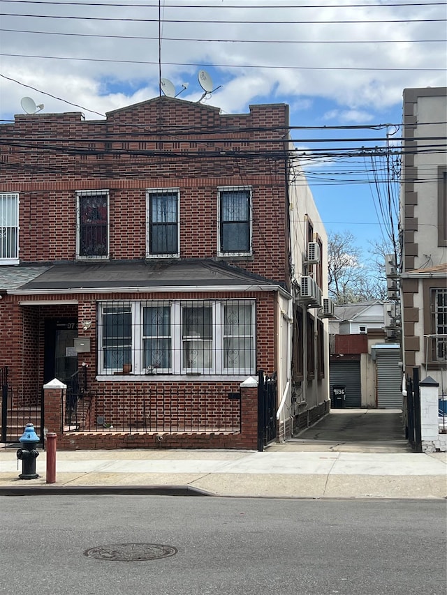 view of front of property featuring brick siding