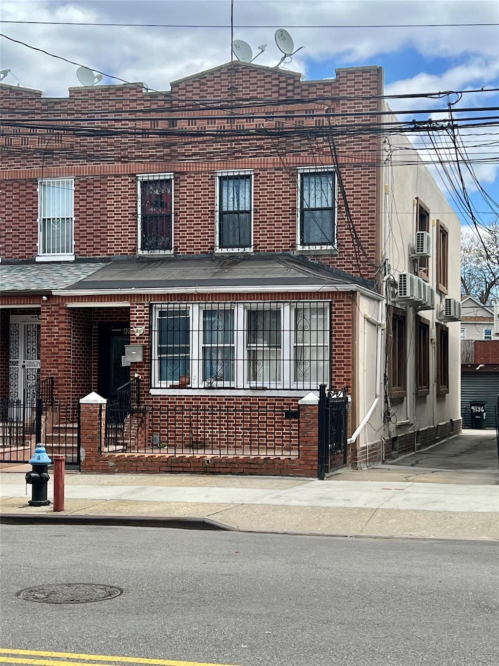 view of property featuring brick siding