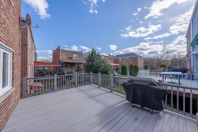 wooden terrace with area for grilling