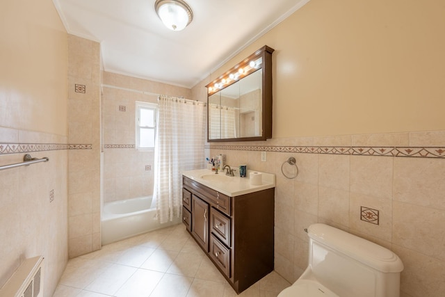 bathroom featuring tile patterned floors, visible vents, tile walls, and toilet