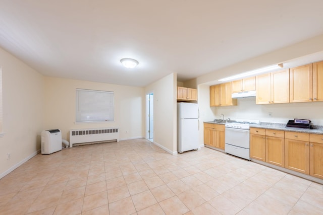 kitchen featuring radiator heating unit, white appliances, baseboards, and under cabinet range hood