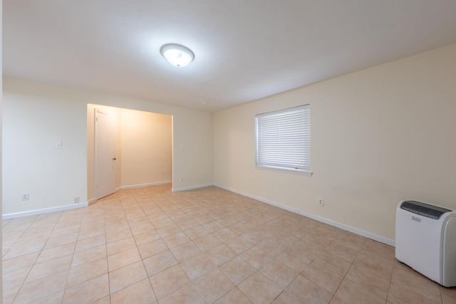 empty room featuring baseboards