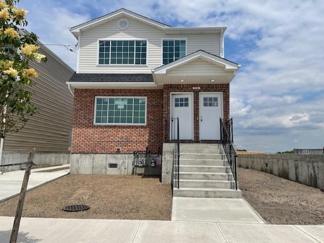62-04 Hillmeyer Rd, Arverne, NY 11692 - traditional home with brick siding