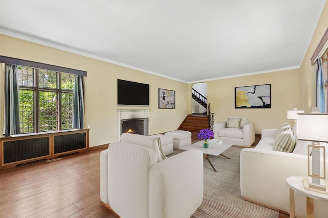 86 Hereford Rd, Bronxville, NY 10708 - living area with a premium fireplace, hardwood / wood-style floors, stairway, and crown molding