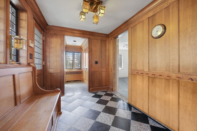 86 Hereford Rd, Bronxville, NY 10708 - mudroom featuring wood walls, dark flooring, and ornamental molding