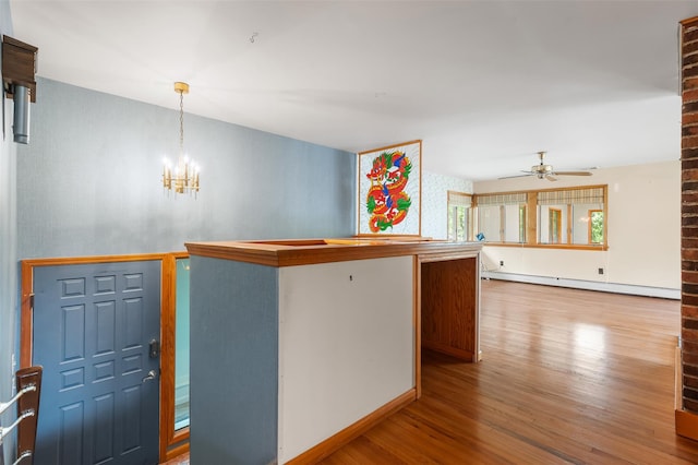 370 Forest Rd, Wallkill, NY 12589 - kitchen featuring a baseboard radiator, wood finished floors, a chandelier, a ceiling fan, and hanging light fixtures