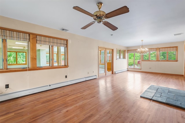 370 Forest Rd, Wallkill, NY 12589 - empty room featuring a chandelier, a baseboard heating unit, light wood-style floors, a ceiling fan, and a baseboard radiator