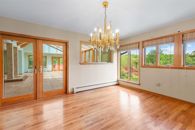 370 Forest Rd, Wallkill, NY 12589 - spare room with baseboard heating, wood finished floors, french doors, and a chandelier