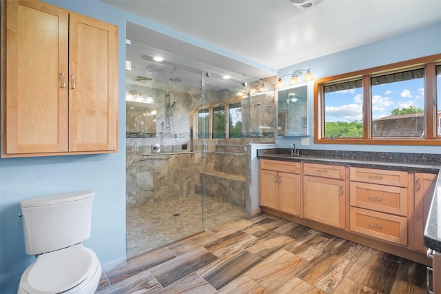 370 Forest Rd, Wallkill, NY 12589 - full bath with a stall shower, vanity, toilet, and wood finished floors