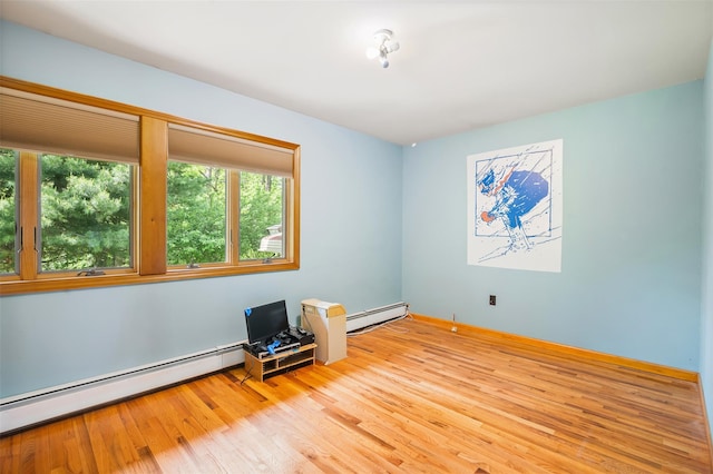 370 Forest Rd, Wallkill, NY 12589 - unfurnished room with a baseboard heating unit, wood finished floors, and baseboards