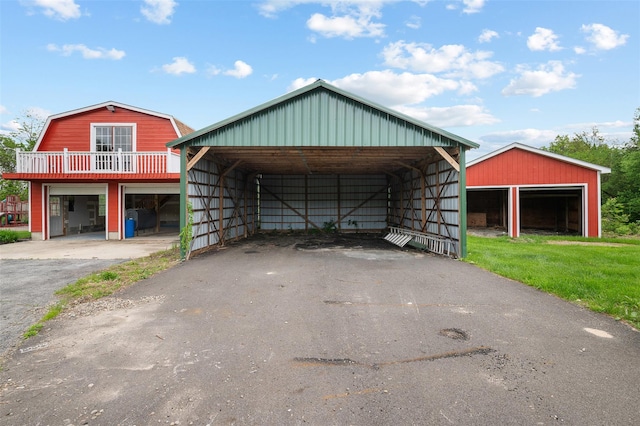 370 Forest Rd, Wallkill, NY 12589 - view of front of property with an outbuilding, a gambrel roof, and asphalt driveway